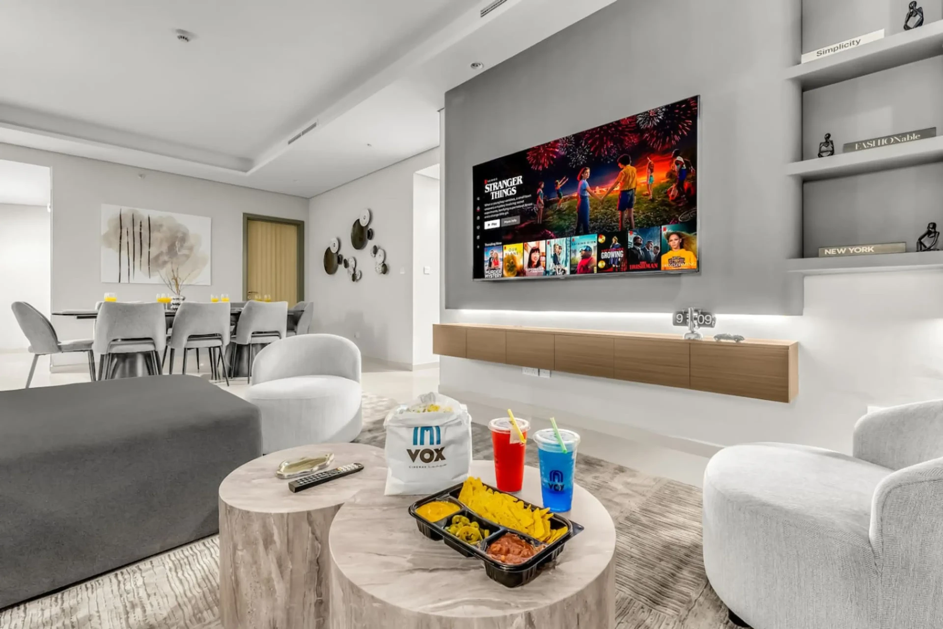 Contemporary lounge with cinema-style TV wall